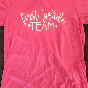 Pink 'First Grade Team' Teacher Short Sleeve Tee By Bella Canvas